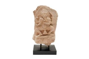 A SMALL CARVED SANDSTONE STELE WITH FOUR-ARMED GANESHA Possibly Vietnam or Cambodia, South East Asia
