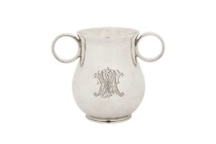 A Victorian sterling silver 'Ox Eye' or college twin handled cup, London 1863 by George John Richard