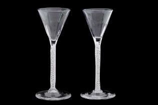 A PAIR OF 18TH CENTURY AIR TWIST WINE GLASSES
