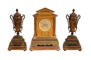 A FRENCH EARLY 20TH CENTURY BRASS CLOCK GARNITURE SET OF ARCHITECTURAL FORM