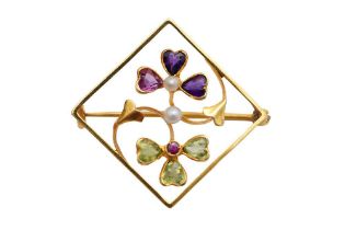 AN AMETHYST AND PERIDOT BROOCH