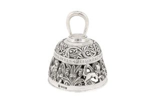 A heavy Edwardian sterling silver cast table bell, Sheffield 1905 by William Hutton and Sons View at
