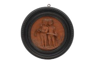 A 19TH CENTURY ITALIAN CARVED ROUNDEL