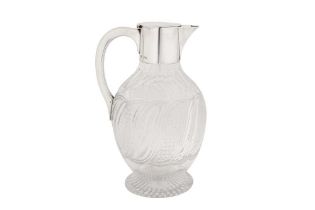 A Victorian sterling silver mounted glass claret jug, London 1891 by Hukin and Heath View at The Bar