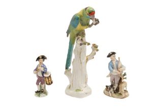 A 19TH CENTURY DRESDEN PORCELAIN FIGURE OF PARROT AND A PAIR OF FIGURES