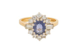 A SAPPHIRE AND DIAMOND CLUSTER RING