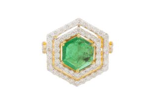 AN EMERALD AND DOUBLE-ROW DIAMOND CLUSTER RING