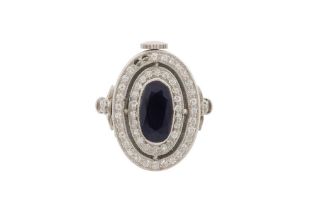 A SAPPHIRE AND DIAMOND WATCH RING