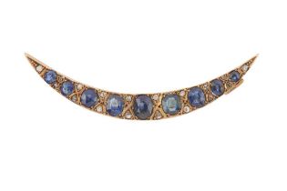 A SAPPHIRE AND DIAMOND CRESCENT MOON BROOCH