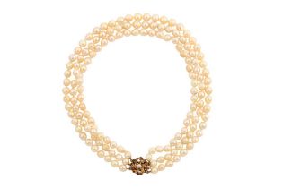 A THREE STRAND PEARL NECKLACE