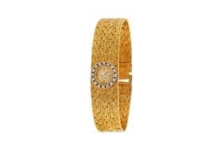 OMEGA - AN 18K GOLD AND DIAMOND-SET BRACELET WATCH