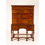 A George II walnut chest of three long and three short drawers on a later three drawer stand,