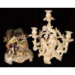 A Meissen white porcelain figural candelabrum and a Continental figure group of Shepherd and