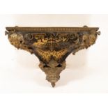 A Boulle work wall bracket with gilt metal mask head mounts to the front corners,