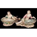 A near pair of figural sweetmeat baskets, gallant and maiden,