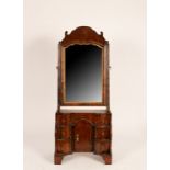 An 18th Century style mahogany toilet mirror, on a kneehole stepped base,