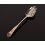 A George III silver strainer spoon, Eley, Fearn & Chawner, London 1808, with pierced bowl,