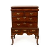 A George II burr elm chest on stand with cabriole legs,