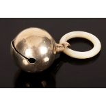 A silver rattle, George Unite, Birmingham 1919, with mother-of-pearl teething ring,