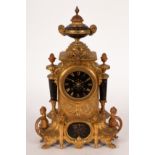 A 19th Century French gilt metal mantel clock with twin-train movement,