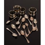 An Edwardian pair of silver napkin rings, London 1902, two others and twelve coffee spoons,