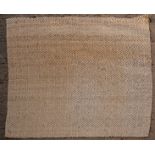 A modern woven rug, cream and brown,