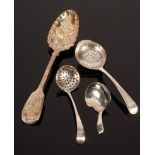 A silver caddy spoon, 1811, initialled F, a berry spoon and two sifter spoons,