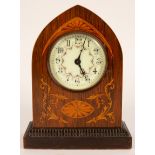 An Edwardian inlaid arch cased mantel clock,