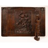 A carved oak panel with allegorical figures in relief,