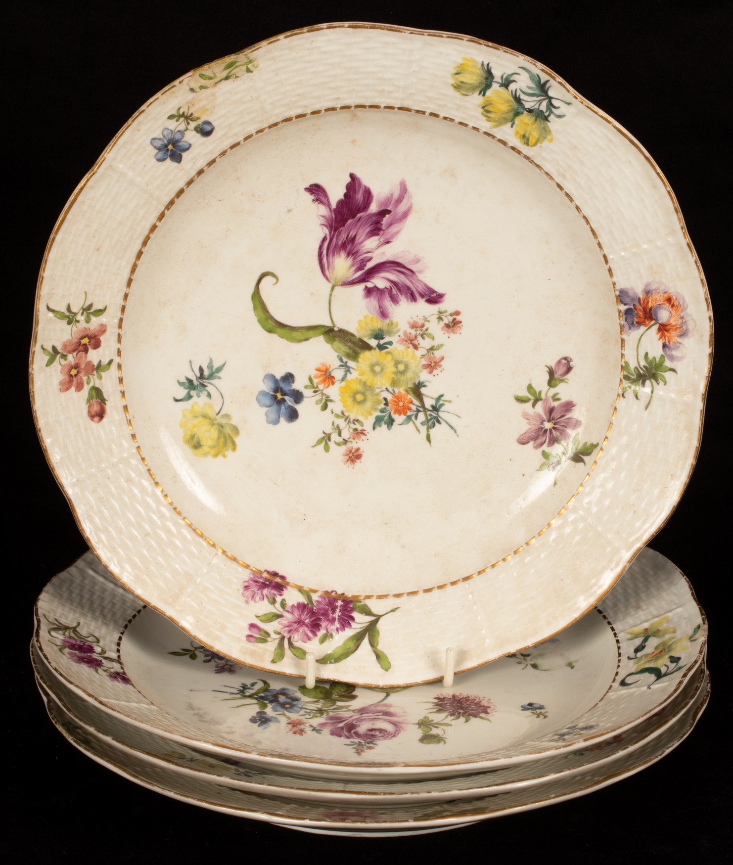 Four Meissen ozier-moulded plates,