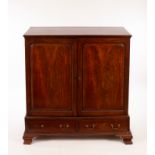 A George III mahogany press cupboard enclosed by panel doors over two short drawers,