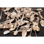 A quantity of sundry silver teaspoons to include four novelty golfing teaspoons with golf ball