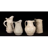 Four saltware jugs, decorated figures in relief, vines and floral motif,