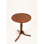 A 19th Century mahogany table on tripod support,