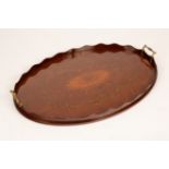 An Edwardian inlaid oval tray with brass handles,