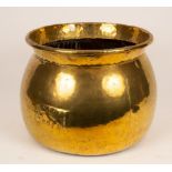 A large brass cauldron,