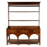 An 18th Century oak dresser with shelves over, 152cm wide,