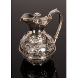 A Victorian silver ewer, Sheffield 1896, with hinged cover and ivory heat absorbers to the handle,