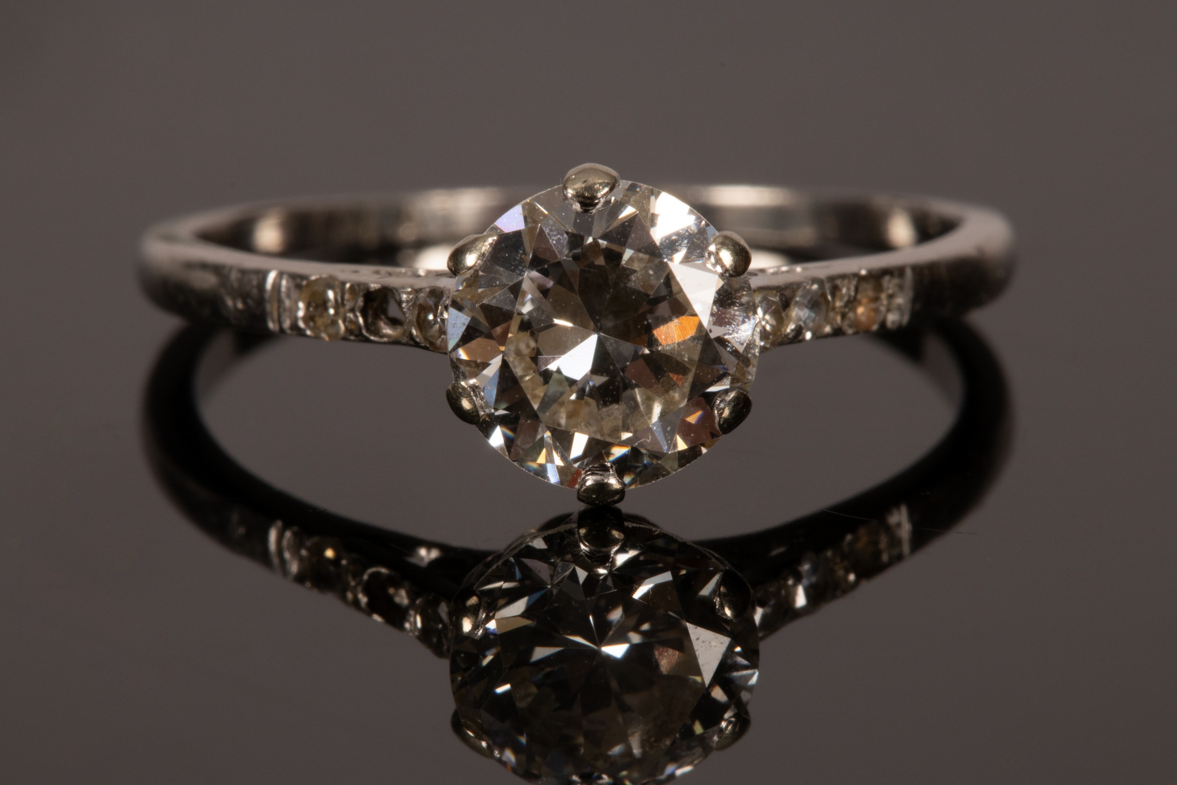 An Art Deco diamond solitaire ring, the old brilliant cut stone of approximately 1.