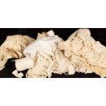 A quantity of lace and textiles, to include garment fragments, collars, a table cloth,