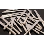 A set of twelve silver handled table knives and twelve side knives,