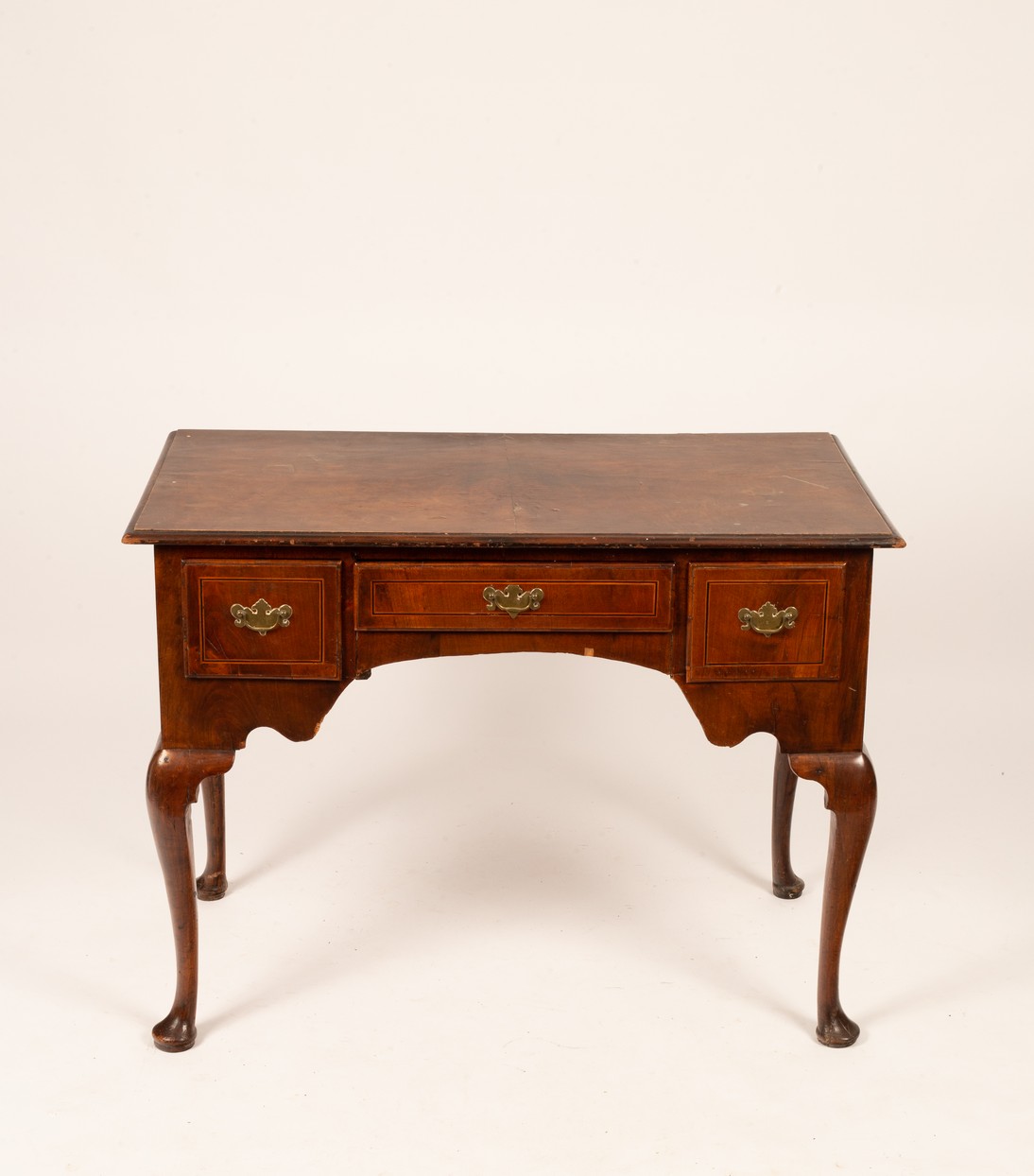 A 19th Century rosewood lowboy, three fitted drawers above tapered legs and pad feet,