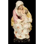 An Enoch Wood pearlware figure of the Madonna and child seated on a stool,