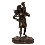 A 19th Century Continental school bronze statue of The Good Shepherd upon a textured base,