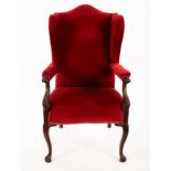 A 19th Century carved framed wingback armchair CONDITION REPORT: Condition