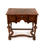 A William and Mary style walnut table, fitted three drawers,