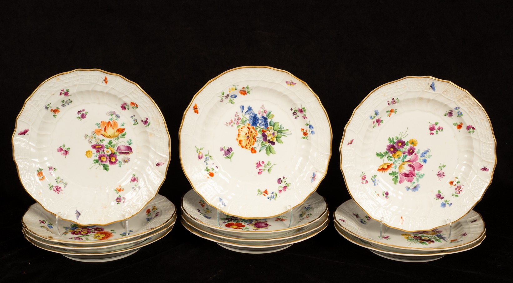 Eleven Meissen neu Brandenstein plates, 19th Century, painted with flower sprays, 24.