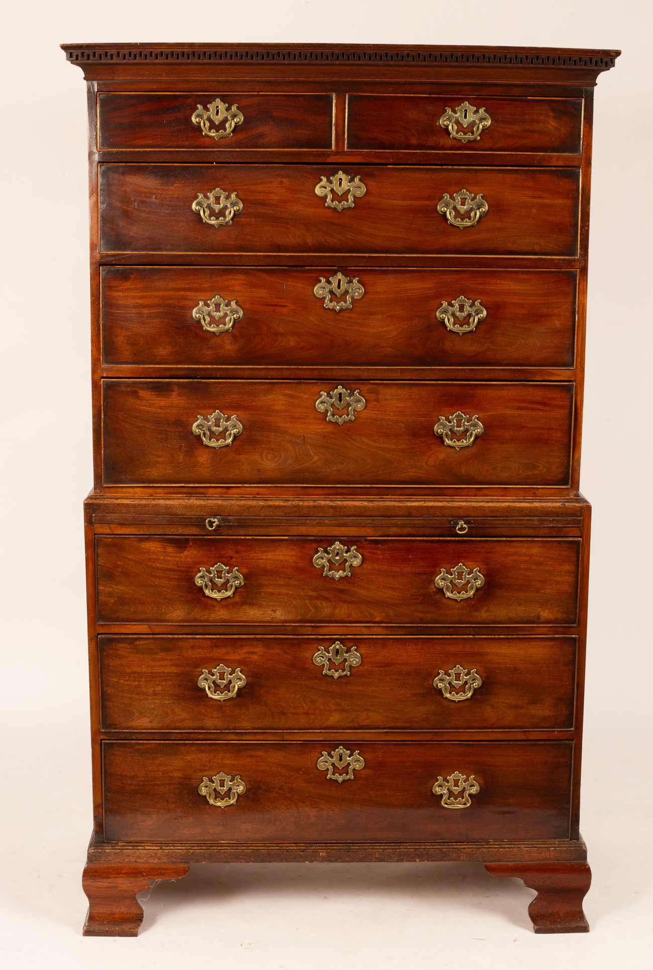 A George III mahogany chest on chest, the upper section of two short over three long drawers,