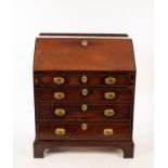A George III mahogany bureau, fitted interior and four drawers on bracket feet,