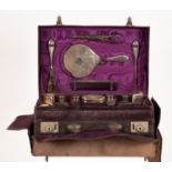 An Edwardian silver mounted travelling vanity set, various silver makers,
